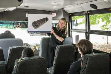 A Bruce Power Visitors’ Centre staffer speaks to people on a bus tour of the facility. Photo provided by Bruce Power.